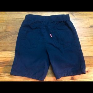 Navy Blue Levi’s shorts.
